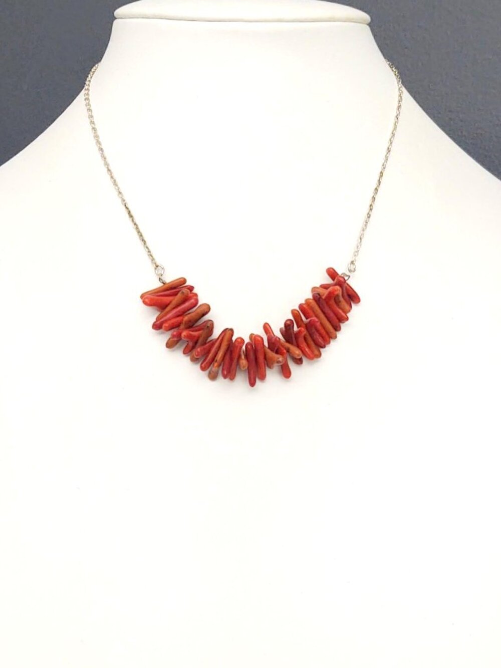 Faux coral on silver chain necklace